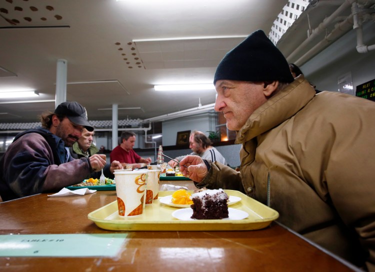 Roland Hamel, 71, of Lewiston gets ready to tuck into his Calvary City Mission meal at Calvary United Methodist Church on  Jan. 6. "They call me the buffet man," said Hamel, who likes to get a little bit of everything at the dinners,.
Derek Davis/Staff Photographer