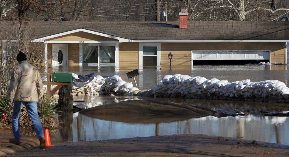 Sandbags failed to hold back water from this house, which stands flooded Friday in Arnold, Mo., as water from the Mississippi, Meremec and Missouri rivers was largely receding in the St. Louis area.