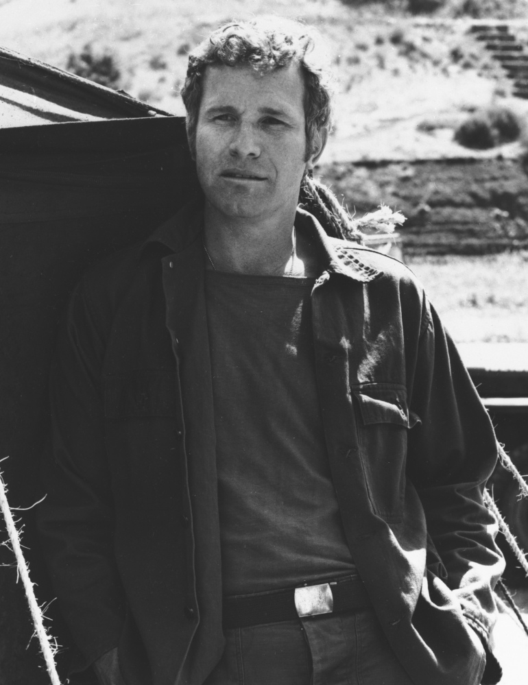 In this photo provided by CBS, Wayne Rogers poses for a photo in his character of Trapper John McIntyre from the television series “M*A*S*H,” in an undated photo.