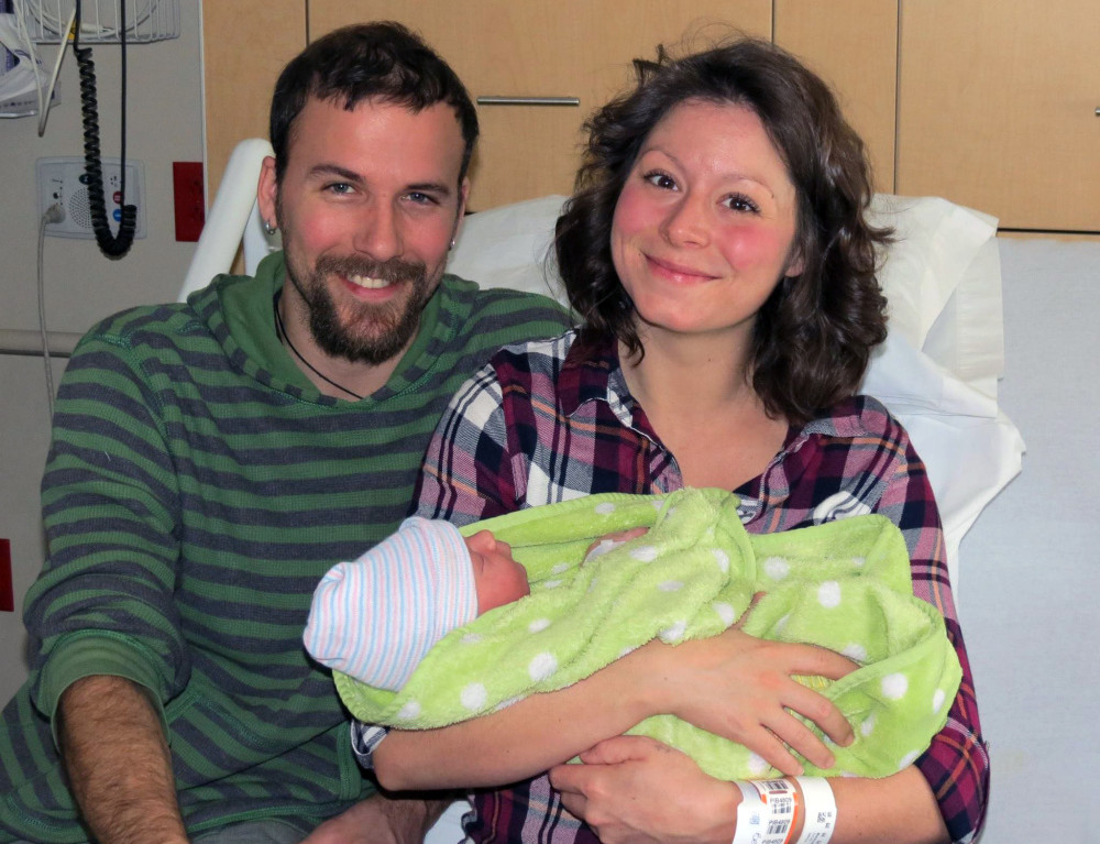 Keltie Beaudoin, seated at MaineGeneral Medical Center with her husband, Adrian, holds their son, Wesley Cooper Beaudoin, the first baby born at MaineGeneral in 2016. Wesley was born at 3:48 a.m. Friday to the Winthrop couple. He weighs 8 pounds and is 21.5 inches long.