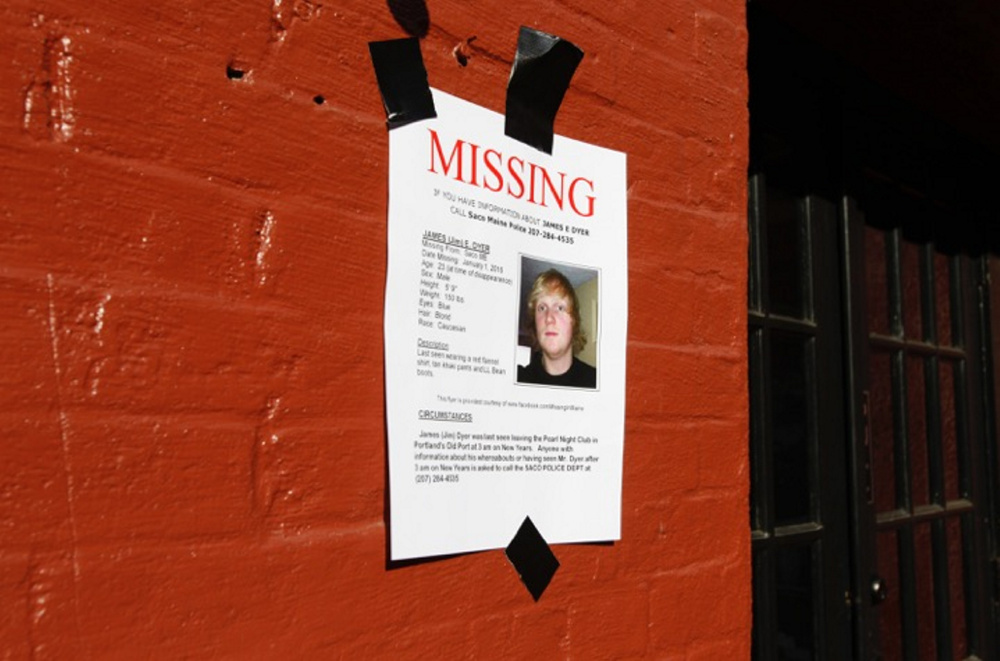Posters are plastered on the walls of the Old Port in Portland, where James Dyer was last scene on New Year’s Eve.