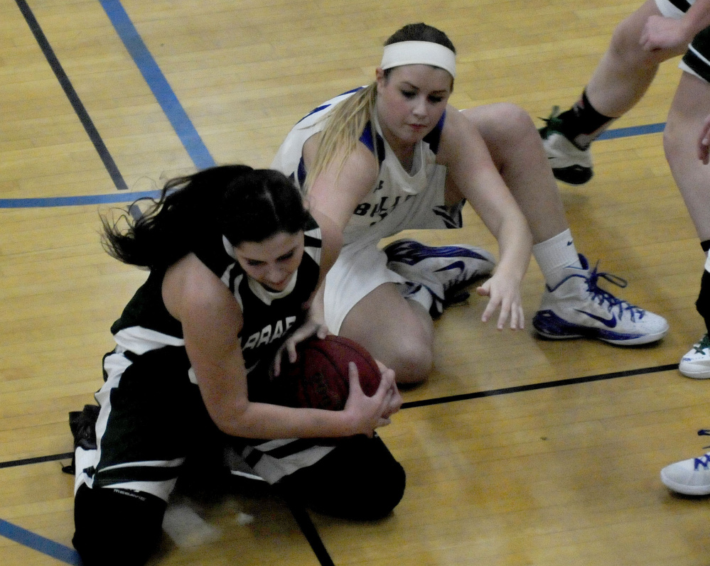 Carrabec’s Kate Stevens, left, and Madison’s Erin Whalen scramble hit the floor to compete for a loose ball during a Mountain Valley Conference game Monday night in Madison.