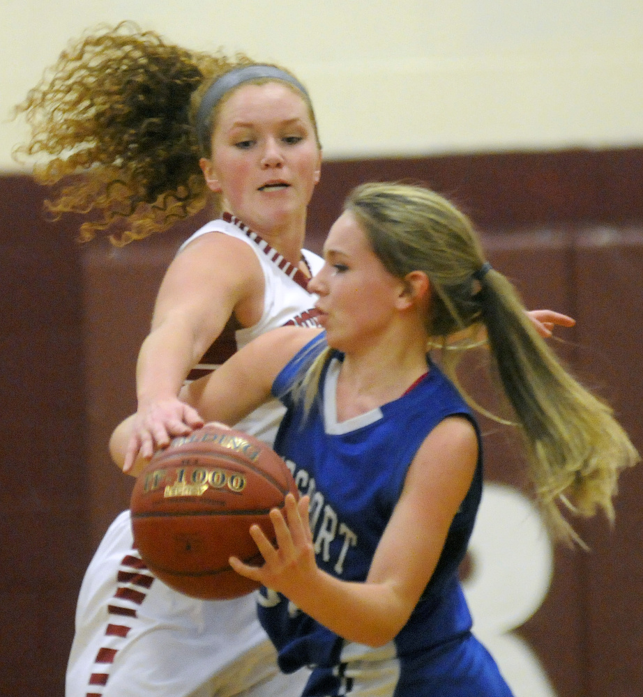 Richmond’s Cassidy Harriman, left, knocks the ball away from Searsport’s Karigen Coffin during a Class C South game Monday night in Richmond.