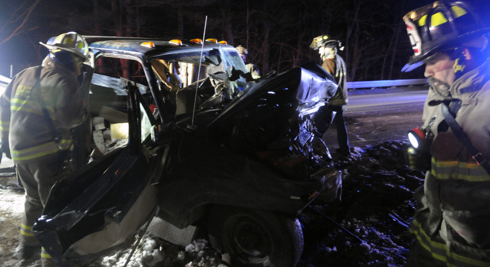 Firefighters check a pickup truck that collided Monday with another pickup on Route 9 in Chelsea, injuring three people. All the victims had to be extricated from the vehicles, police said, to be treated for injuries.