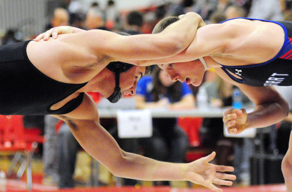 Staff file photo by Joe Phelan 
 Skowhegan's Kam Doucette, left, and Mt. Ararat's Robert Heatherman compete at the Cony Duals in Augusta earlier this season. Doucette is on a roll with the Indians of late.