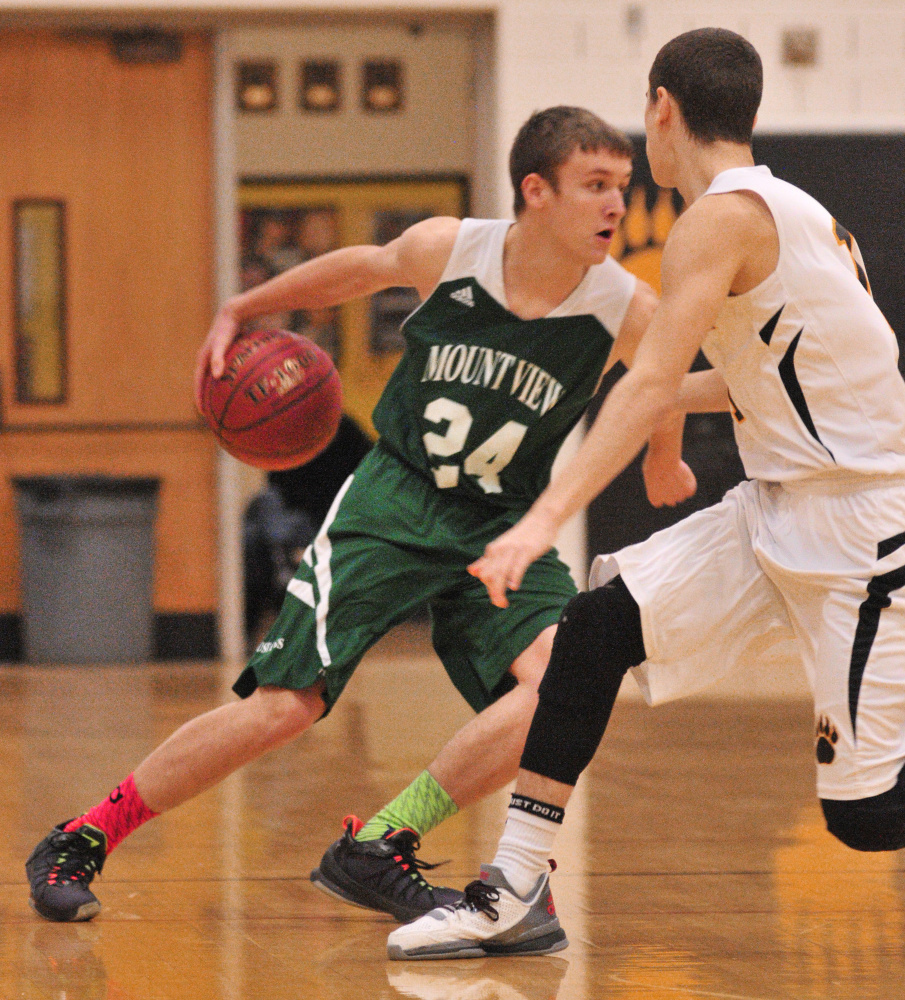 Mount View’s Joey Danna, left, tries to dribble around Maranacook’s Kyle Wilbur during a game Tuesday in the Mr. Burbank Memorial Gym in Readfield.