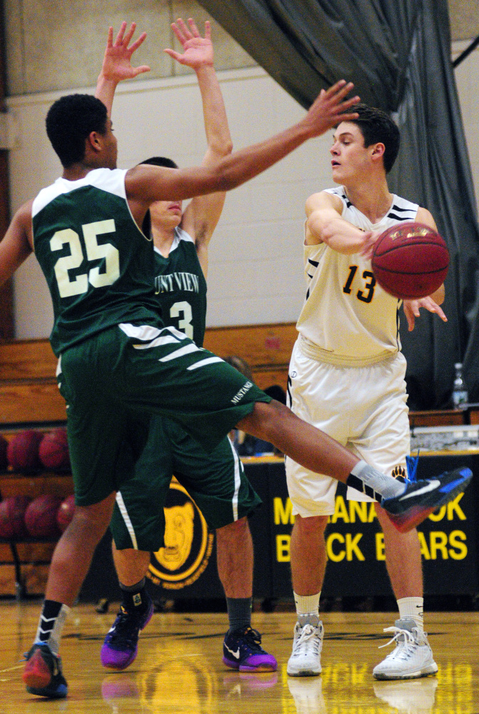 Mount View’s Devon Davis, left, and Colby Furrow press against Maranacook’s Kent Molar during a game Tuesday in the Mr. Burbank Memorial Gym in Readfield.