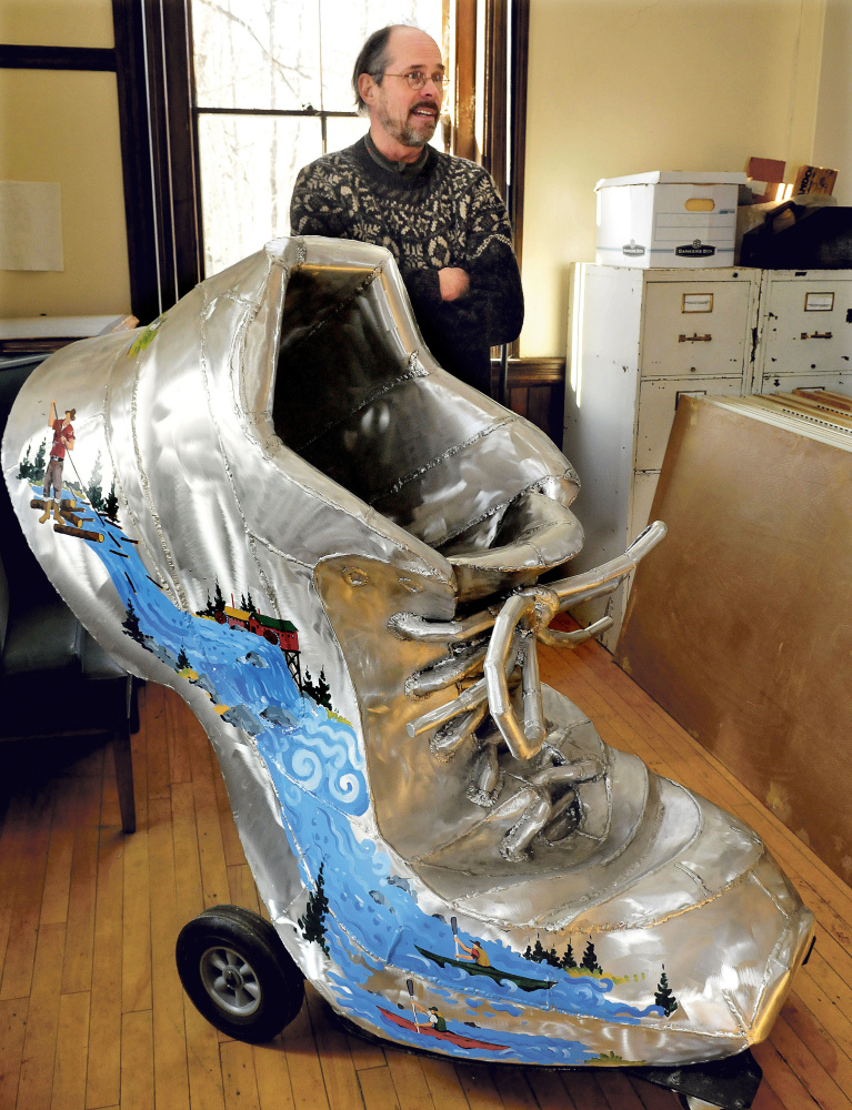 Steve Dionne on Wednesday speaks about the effort to put the town’s giant shoe sculpture in downtown Skowhegan after it’s been in storage. The artwork commemorates the town’s shoe industry and youth fitness.