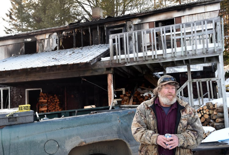 David Ladd stands in front of his Bunker Hill Road home that was destroyed by fire Thursday morning.