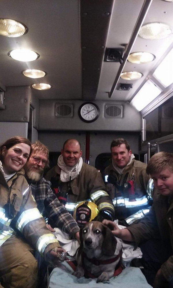 Area police and firefighters worked to save a dog named Sam, who was found unconscious Thursday night at a fire on Town Farm Road in Hallowell.