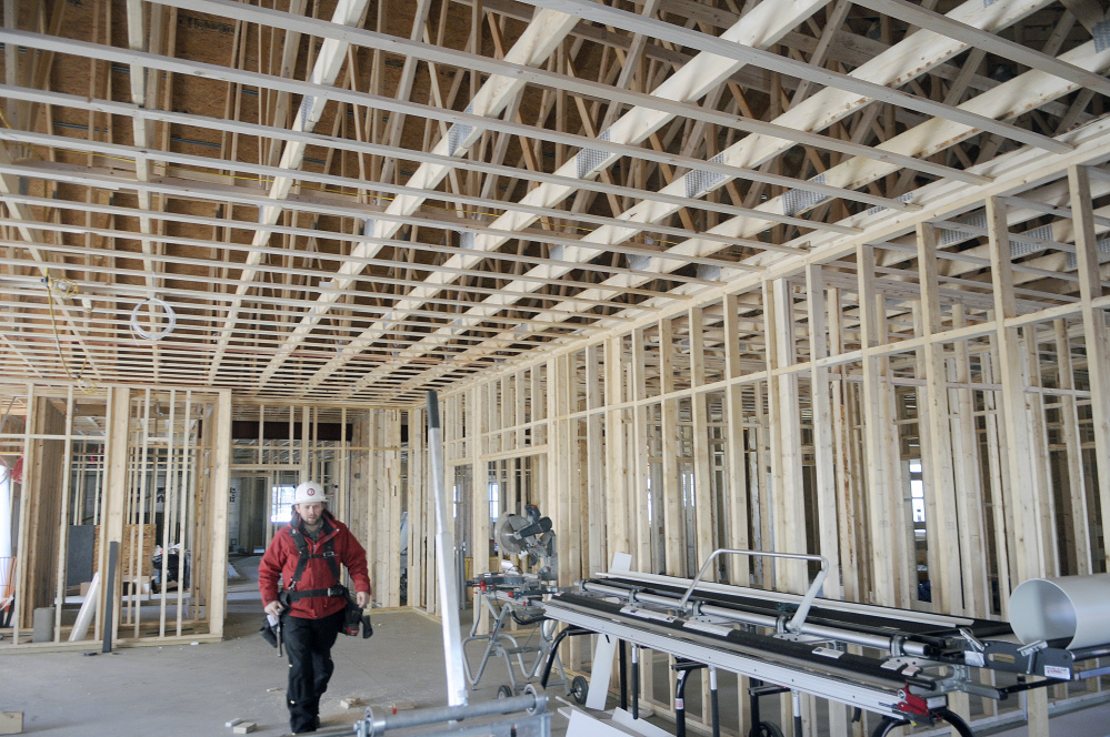 Uriah Pelletier of Kavestone LLC walks through the meeting room Wednesday at the future home of the Belgrade Town Office.
