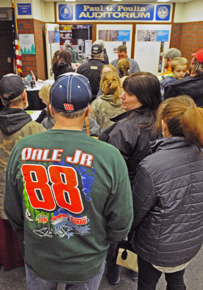 Dale Earnhardt Jr. fan Howard White, of Benton, waits in line to enter the Northeast Motorsports Expo on Friday in the Augusta Civic Center.