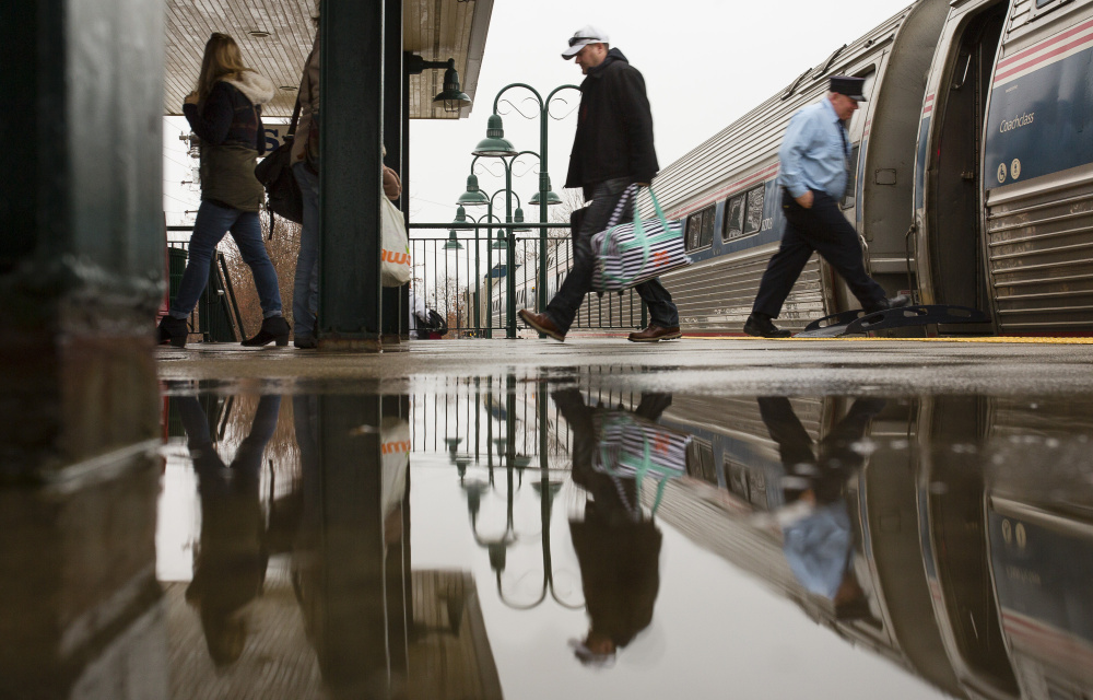 SACO, ME - JANUARY 10: Passengers disembark the northbound train from Boston at the Saco Transportation Center a rainy Sunday in Saco, Maine on January 10, 2016 . (Photo by Carl D. Walsh/Staff Photographer)