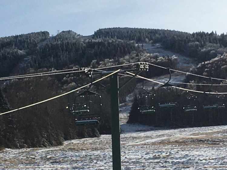 The chairlifts at Saddleback Mountain are empty and unused as the ski resort remains closed. The mountain may open later this month as the loose ends of a sale are tied up.