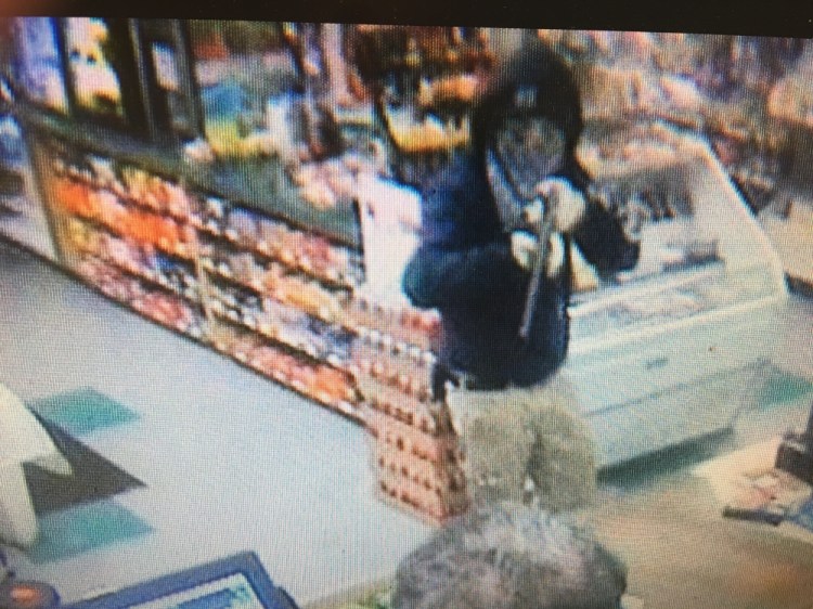 A man wielding a rifle or shotgun robbed a convenience store on Riverside Drive in Augusta Tuesday night.
