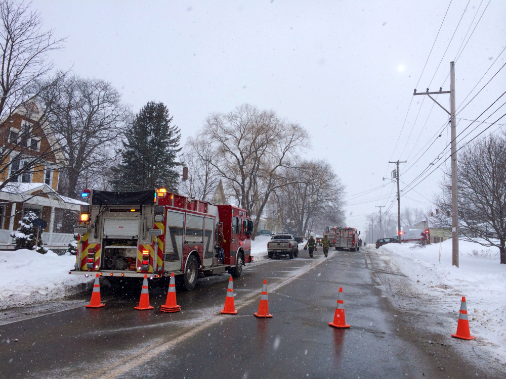 Old Point Avenue, which is also U.S. Route 201A and one of the main streets through Madison, was blocked Monday afternoon as firefighters responded to a house fire.