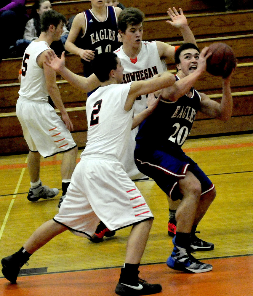 Messalonskee’s Jack Bernatchez looks for a shot as Skowhegan’s Christopher Marcus (2) defends during a Kennebec Valley Athletic Conference Class A game Monday afternoon.
