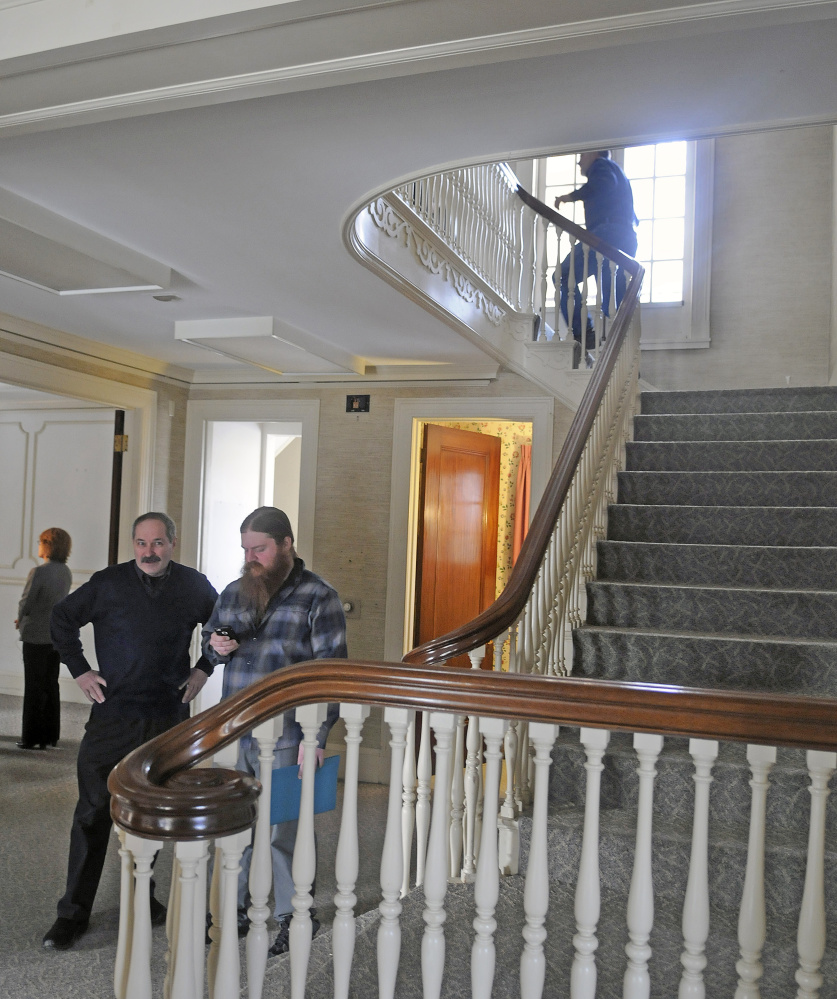 Guests explore the Gannett House in Augusta Tuesday during announcement by heirs of Maine publisher Guy Gannett that the former state office building will be converted into a First Amendment museum.