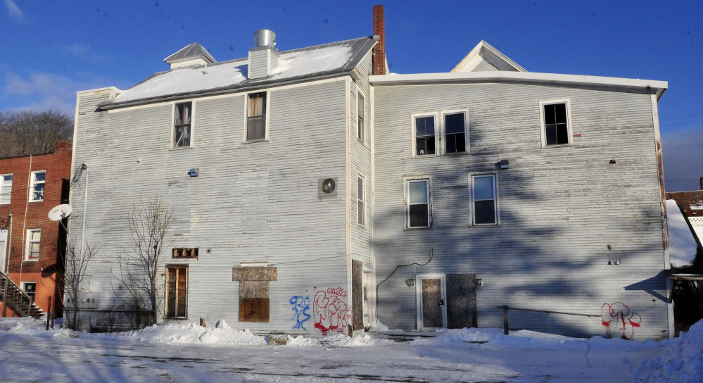 The rear side of the vacant and dilapidated Antlers Inn building in Bingham on Wednesday. Vacant for eight years, the building may be torn down by the town.