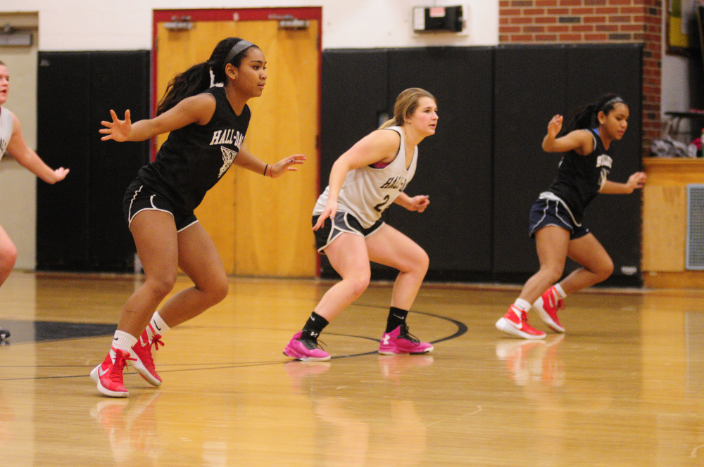 Thea Sweet, left, Emma Begin, center, and Dani Sweet run drills Tuesday at Penny Memorial Gym in Farmingdale.