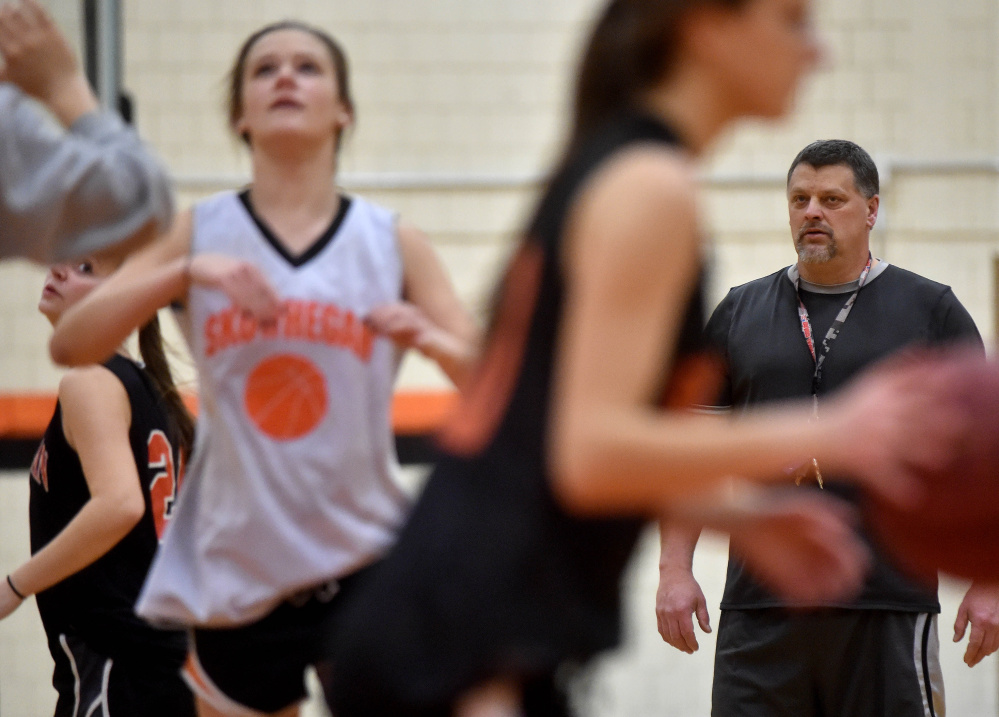 Skowhegan Area High School girls basketball coach Mike LeBlanc keeps a careful watch on a practice drill Wednesday.