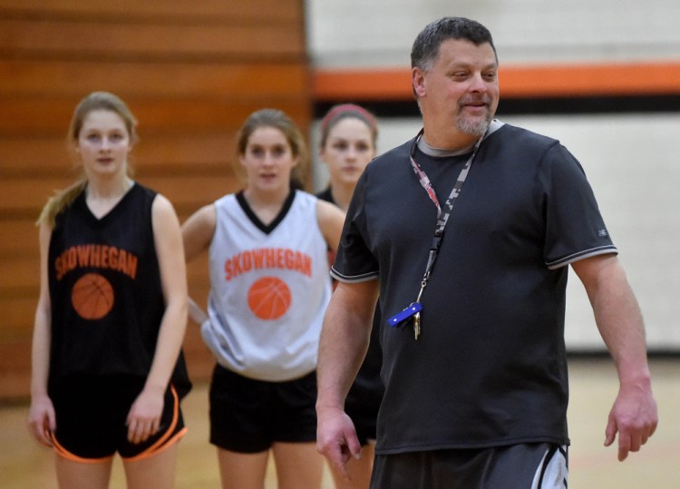 Skowhegan Area High School girls basketball coach Mike LeBlanc puts his team through drills during practice Wednesday.