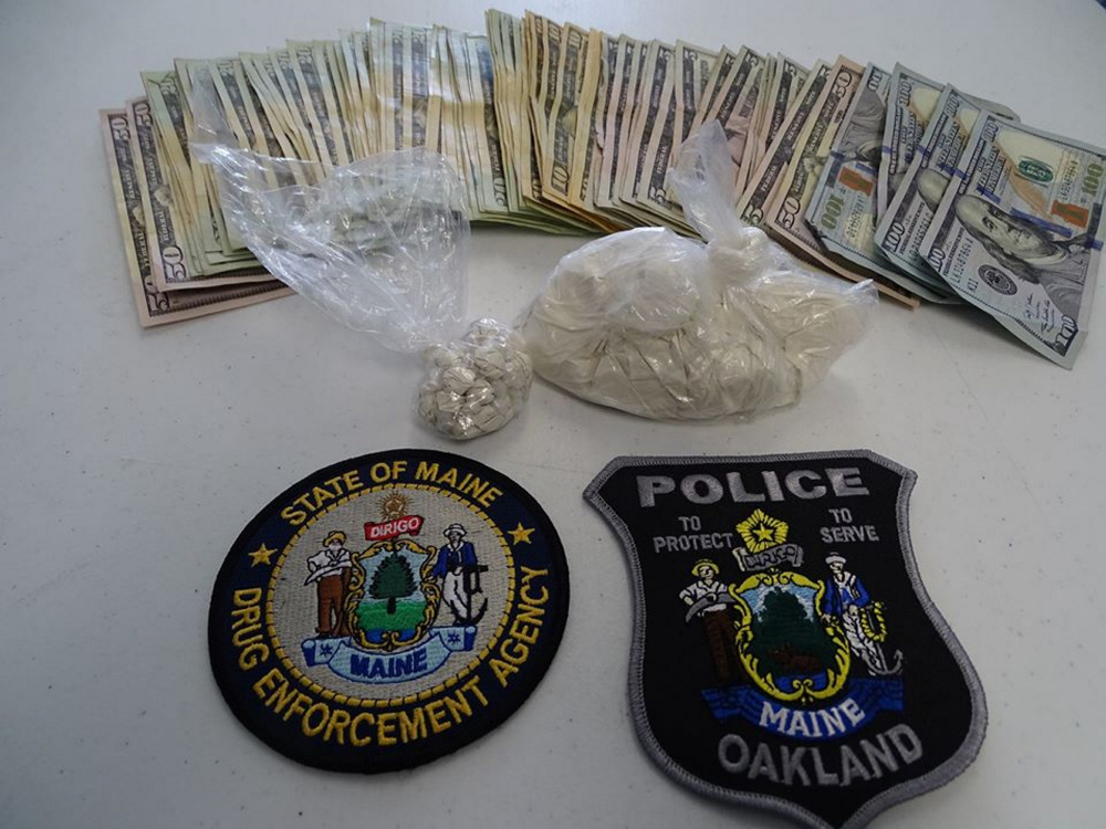 Heroin and money the Maine Drug Enforcement Agency says it seized during a Thursday morning bust in Oakland.