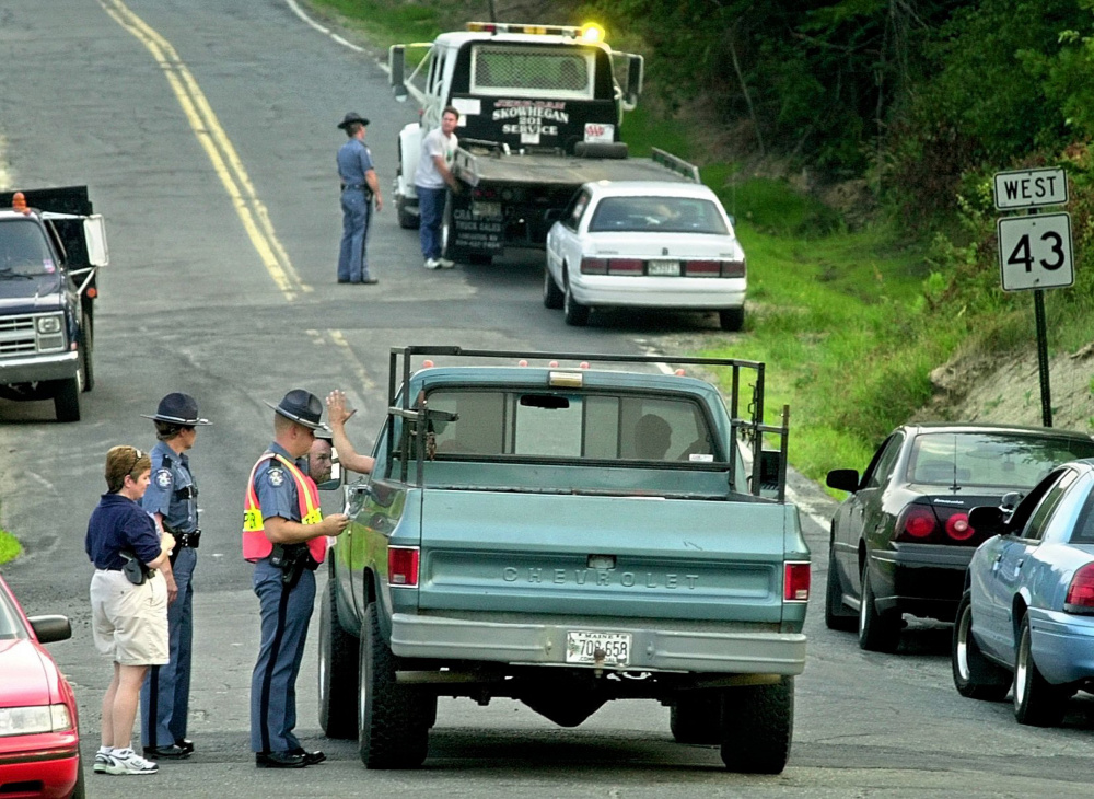 State police operate a roadblock near the entrance to Hempstock, a marijuana festival, in Starks in 2002. The town, with a long history of divided opinion concerning marijuana issues, is considering a temporary moratorium on medical marijuana businesses until officials can determine what kind of regulations may be needed.