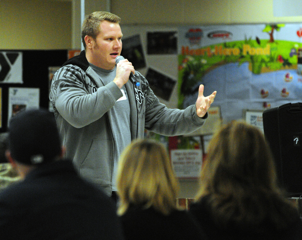 Andrew Kiezulas, from the Young People in Recovery group, gives opening remarks Thursday during the Opiates in Gardiner event at Gardiner Regional Middle School.