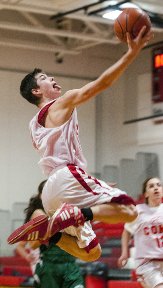 Cony’s Matthew Baker goes up for a layup during a unified basketball game against Winthrop on Friday at Cony High in Augusta.