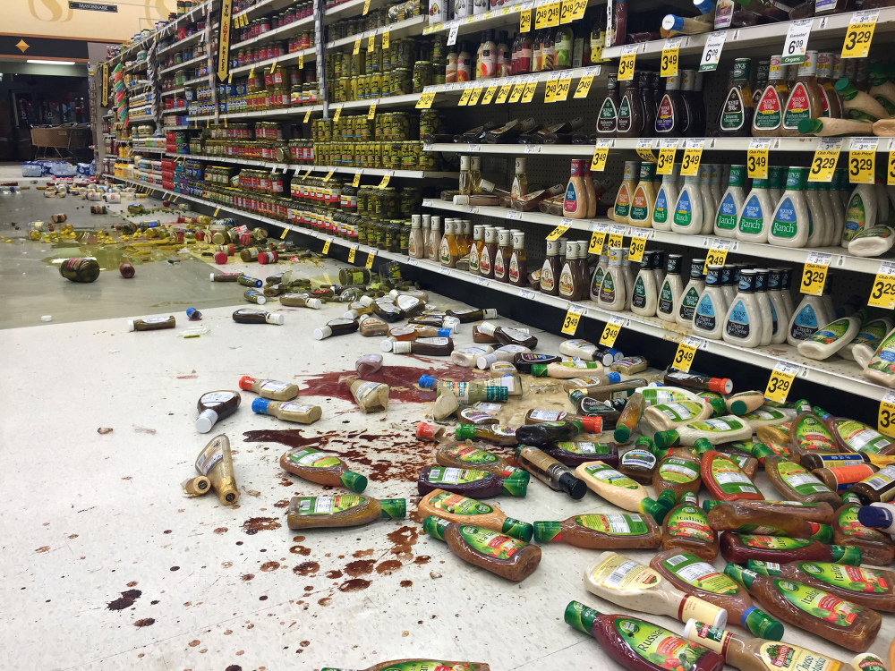 In this photo provided by Vincent Nusunginya, items fallen from the shelves litter the aisles inside a Safeway grocery store following a magnitude 6.8 earthquake on the Kenai Peninsula on Sunday in south-central Alaska.