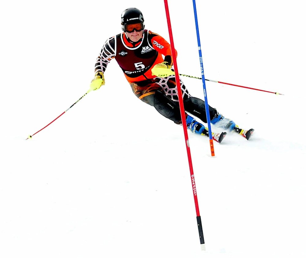 In this Feb. 17, 2015 photo Kyle Farrington of Mt. Blue High School makes his way to the finish line during slalom races at Mt. Abram in Greenwood.