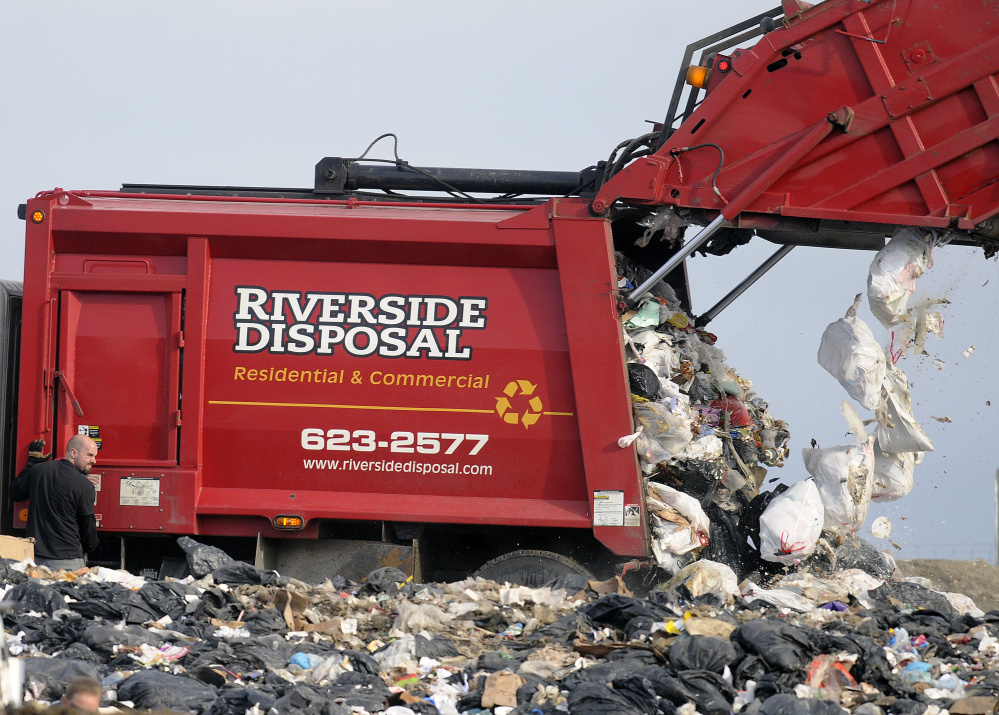A Riverside Disposal truck dumps a load Tuesday at Hatch Hill Landfill in Augusta. The Augusta City Council is considering a decrease in per capita fees for towns using the facility.