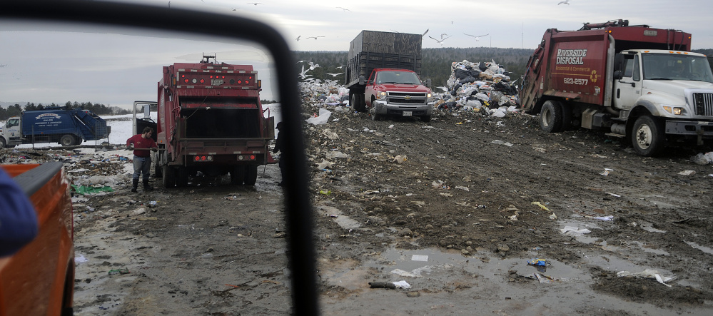 Dump trucks unload Tuesday at Hatch Hill Landfill in Augusta.
