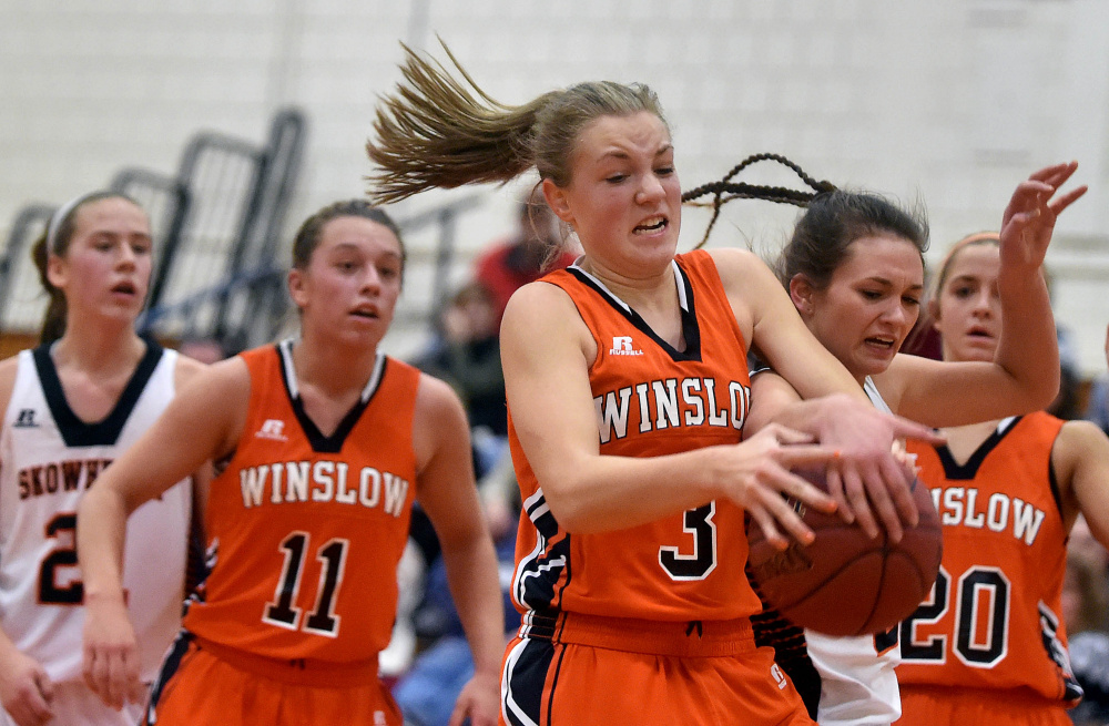 Winslow High School’s Paige Trask (3) battles for the rebound with Skowhegan Area High School’s Alyssa Cobb during a Jan. 15 game.