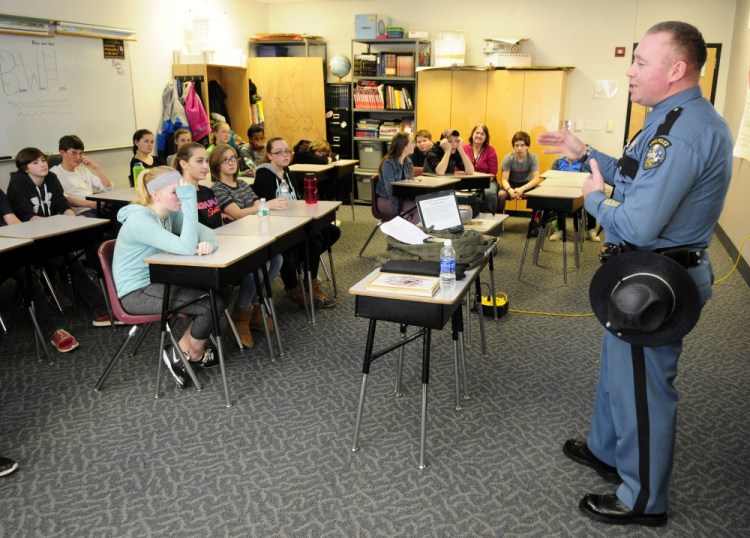 Maine State Police Trooper Bernard Campbell talks to students during Healthy Decisions Day events on Friday at Maranacook Community Middle School in Readfield.