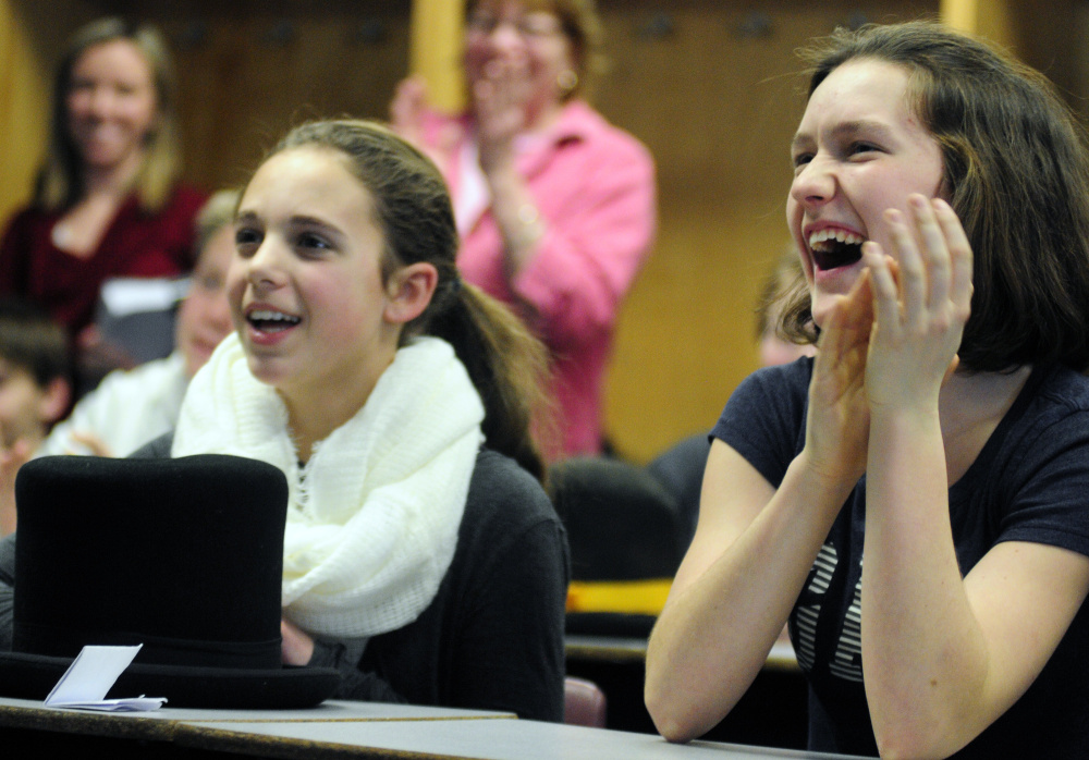 Caroline Welch, left, and Dana Reynolds clap during Randy Judkins’ presentation during Healthy Decisions Day events on Friday at Maranacook Community Middle School in Readfield.
