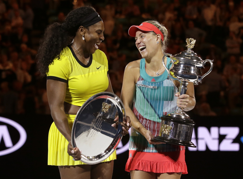 Angelique Kerber, right, of Germany enjoys a joke with runner-up Serena Williams of the United States after winning their women’s singles final at the Australian Open tennis championships in Melbourne, Australia, Saturday.