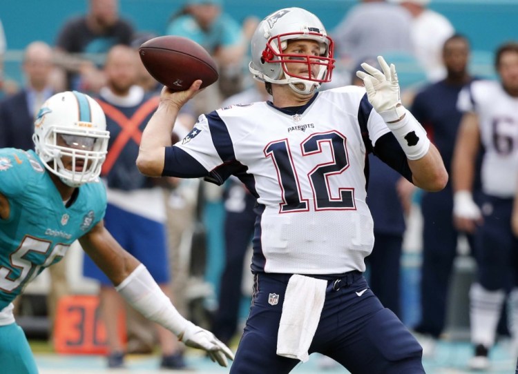 New England Patriots quarterback Tom Brady aims to pass during the second half of an NFL football game against the Miami Dolphins on Sunday in Miami Gardens. Brady suffered a right ankle injury in the season finale.