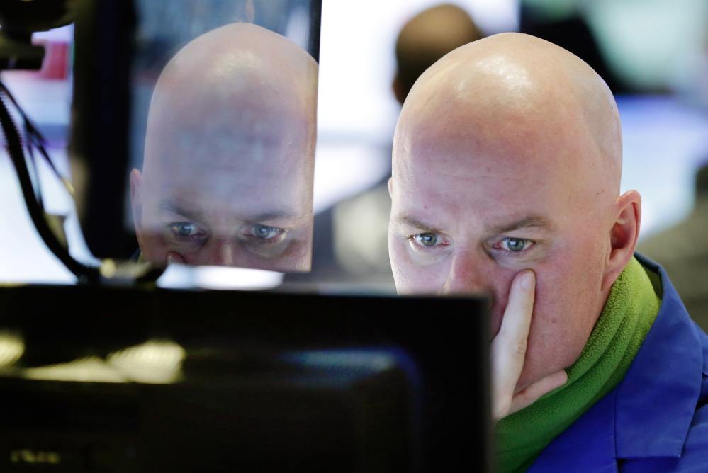 Specialist John O’Hara works at his post on the floor of the New York Stock Exchange on Thursday.