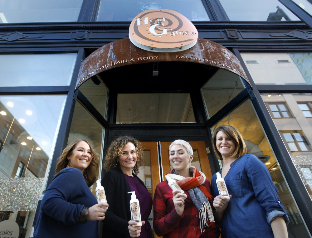 Allana York, second from left, and Head Games stylists Sarah Beliveau, left, Rachel Helm and Courtney Buchanan, right, are trained in the Controlled Chaos haircutting technique.