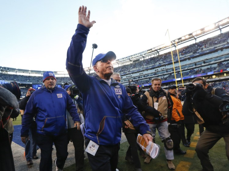 New York Giants head coach Tom Coughlin walks off the field after the Giants lost 35-30 to the Philadelphia Eagles in an NFL football game, Sunday, Jan. 3, 2016, in East Rutherford, N.J. (AP Photo/Julio Cortez)