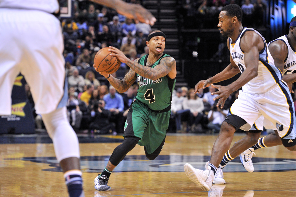 Celtics guard Isaiah Thomas drives to the basket while being defended by Grizzlies guard Tony Allen during Boston’s 101-98 loss Sunday in Memphis, Tenn.