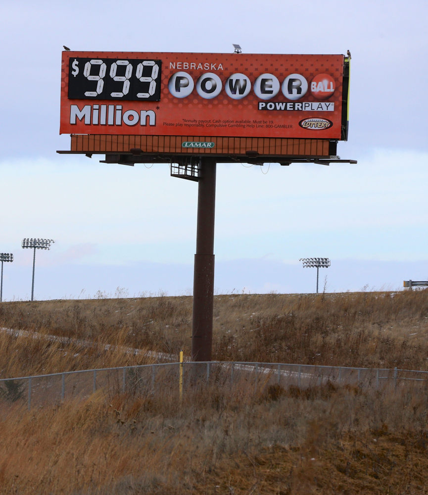 Billboards like this one outside Waverly, Neb., have to advertise the prize as $999 million because they’re not built to show billions.