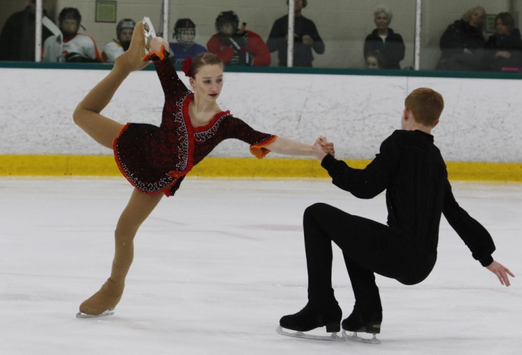 Julia Curran and Franz-Peter Jerosch perform their routine Monday night before a crowd of family and friends at the Family Ice Center in Falmouth. It was one of their final tune-ups before leaving for the U.S. Figure Skating Championships in Minnesota.