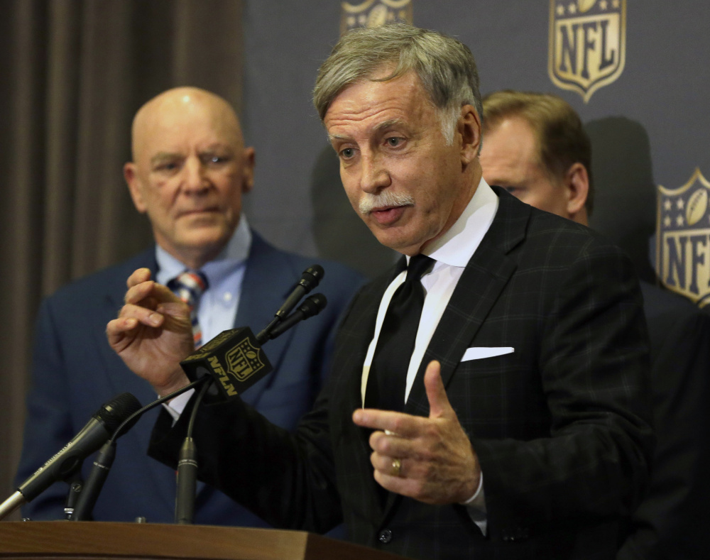 St. Louis Rams owner Stan Kroenke talks to the media after team owners voted Tuesday in Houston to allow the Rams to move to a new stadium just outside Los Angeles. The San Diego Chargers will have an option to share the facility. Houston Texans owner Bob McNair stands to Kroenke’s left. (AP Photo/Pat Sullivan)