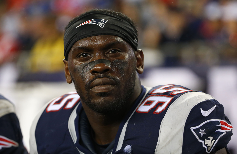 New England Patriots defensive end Chandler Jones arrived shirtless at the back door of the Foxborough (Mass.) Police Department on Jan. 10. The Associated Press.