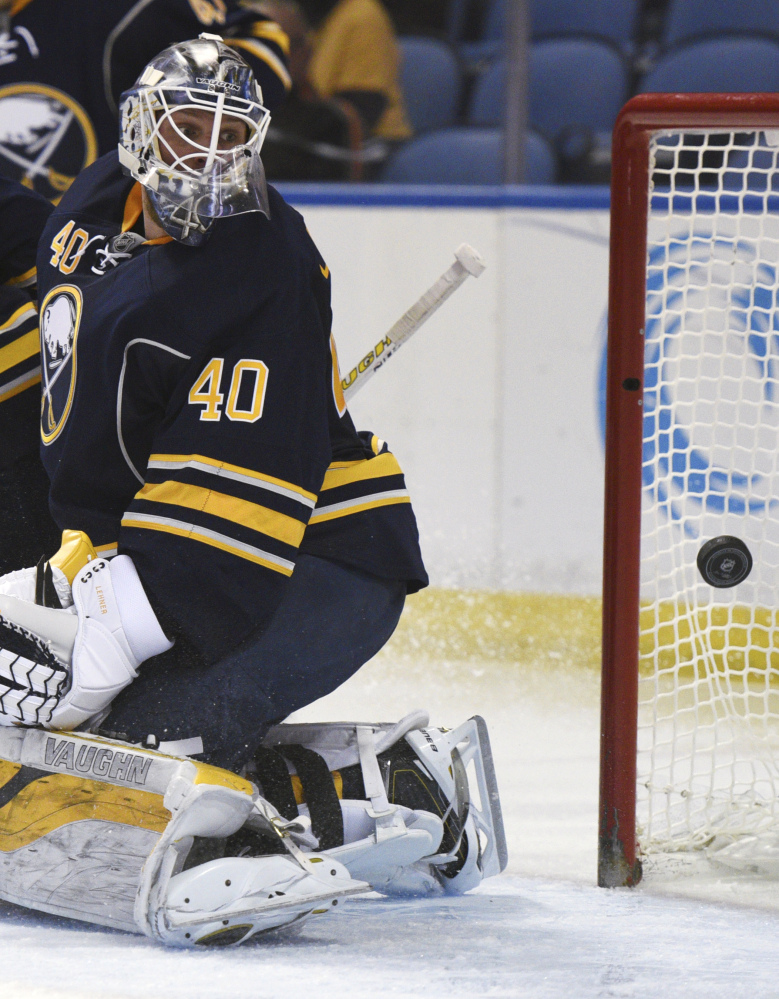 Sabres goaltender Robin Lehner looks at the puck behind him on the game-tying goal by the Bruins’ Matt Beleskey in the second period.