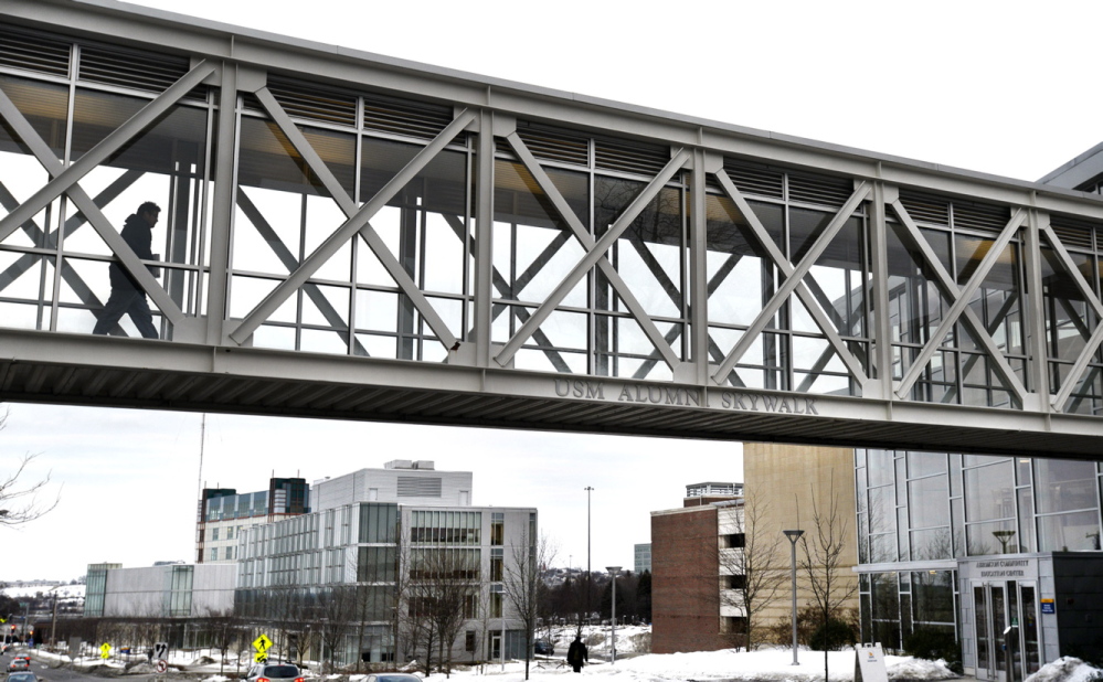 A University of Southern Maine student uses the Bedford Street skywalk to get to classes on the Portland campus, one of the possible locations for an envisioned graduate school.