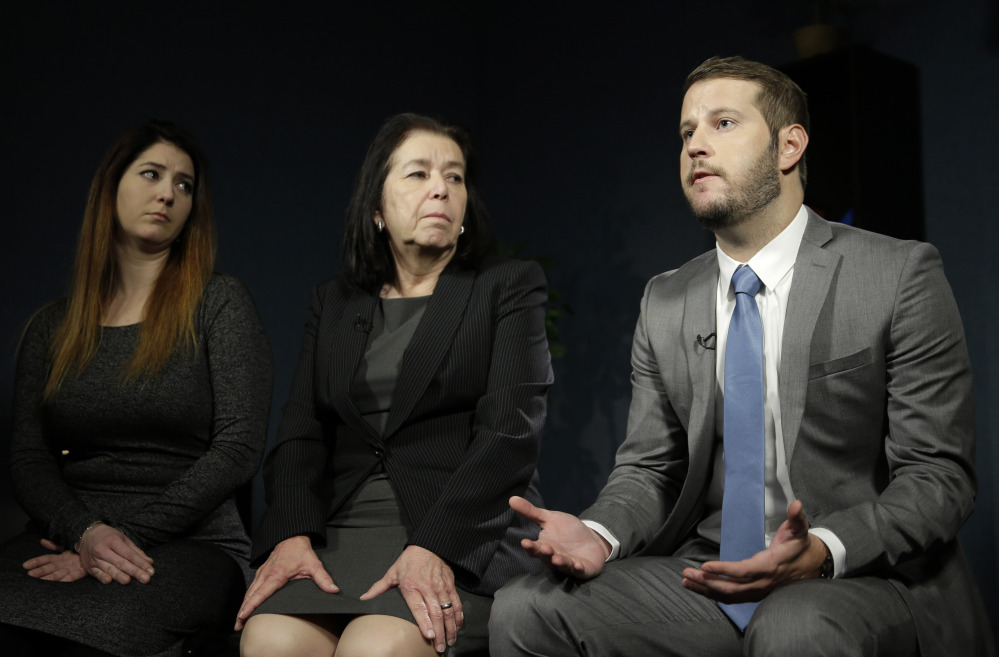 Christine Levinson, center, wife of Robert Levinson, and her children, Dan and Samantha Levinson, talk to reporters in New York on Monday. Robert Levinson, a former FBI agent, disappeared in Iran almost nine years ago.
